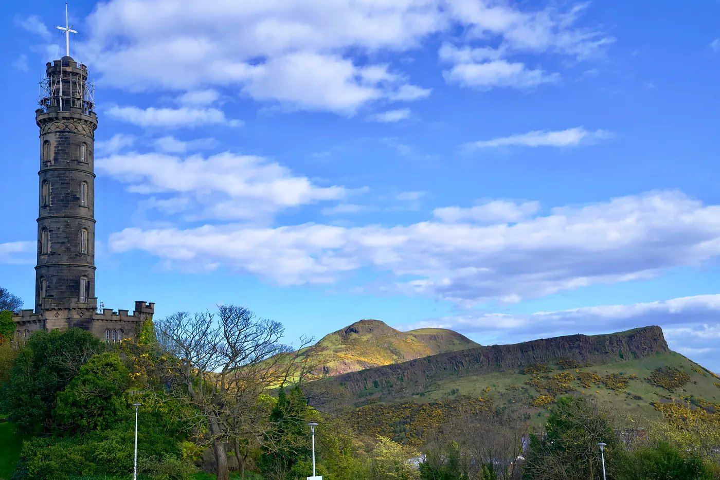 The Nelson Monument, named after legendary British Admiral Nelson, with Arthur's Seat and the Crags in the distance.