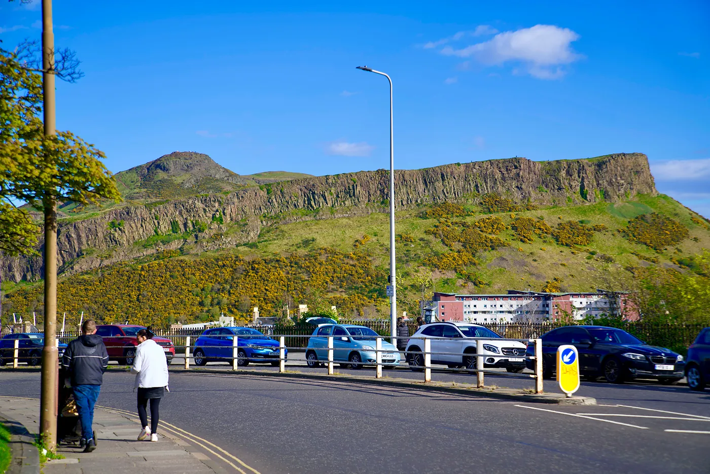 Arthur's Seat and the Crags visible from a road descending Calton.