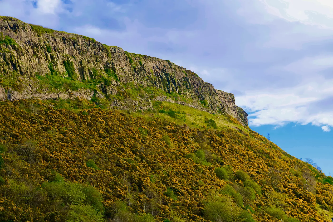 The edges of the Crags, a large basalt cliff, from the base of Holyrood.