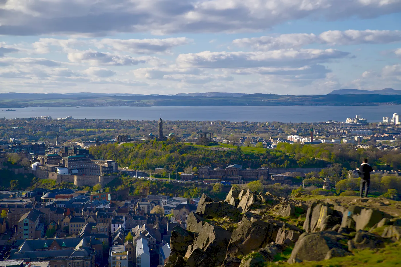 A distant Calton Hil catching a man's gaze.