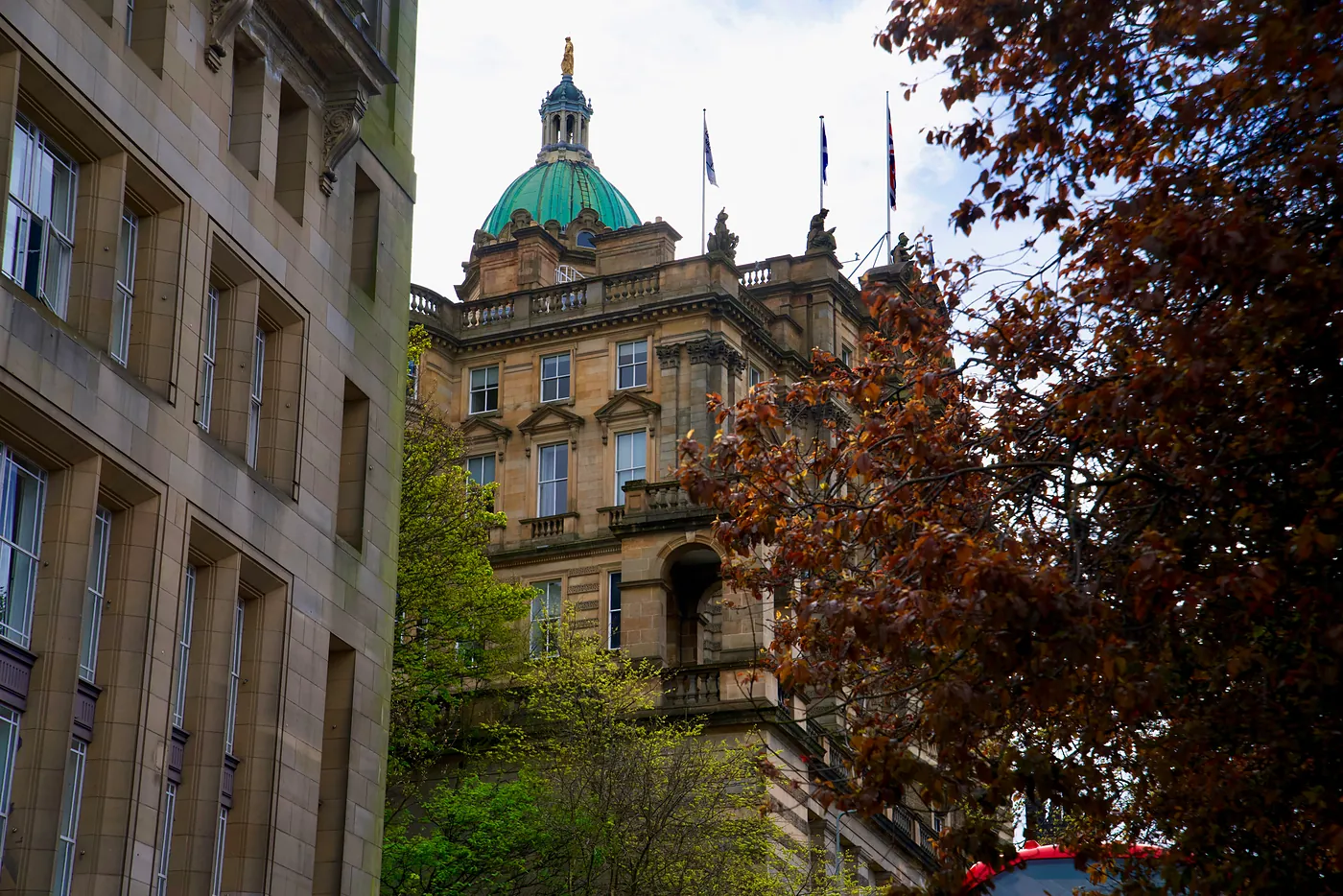The dome and eastern side of the Bank of Scotland, which is connected to the upper end of the High Street.