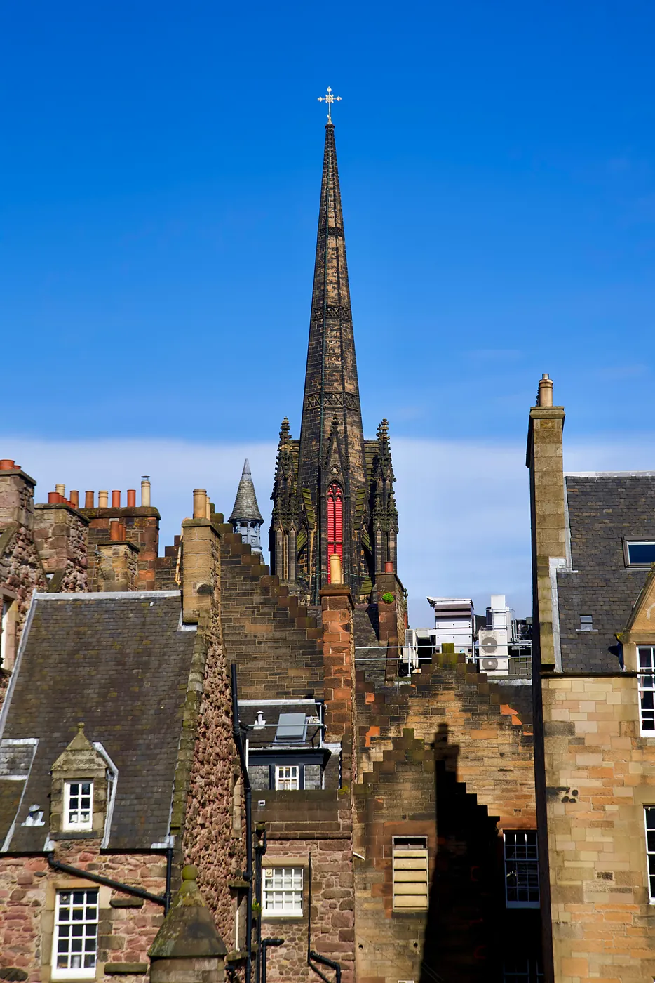 Saint Columba's imposing and gothic tower admist the Mile's rooftops.