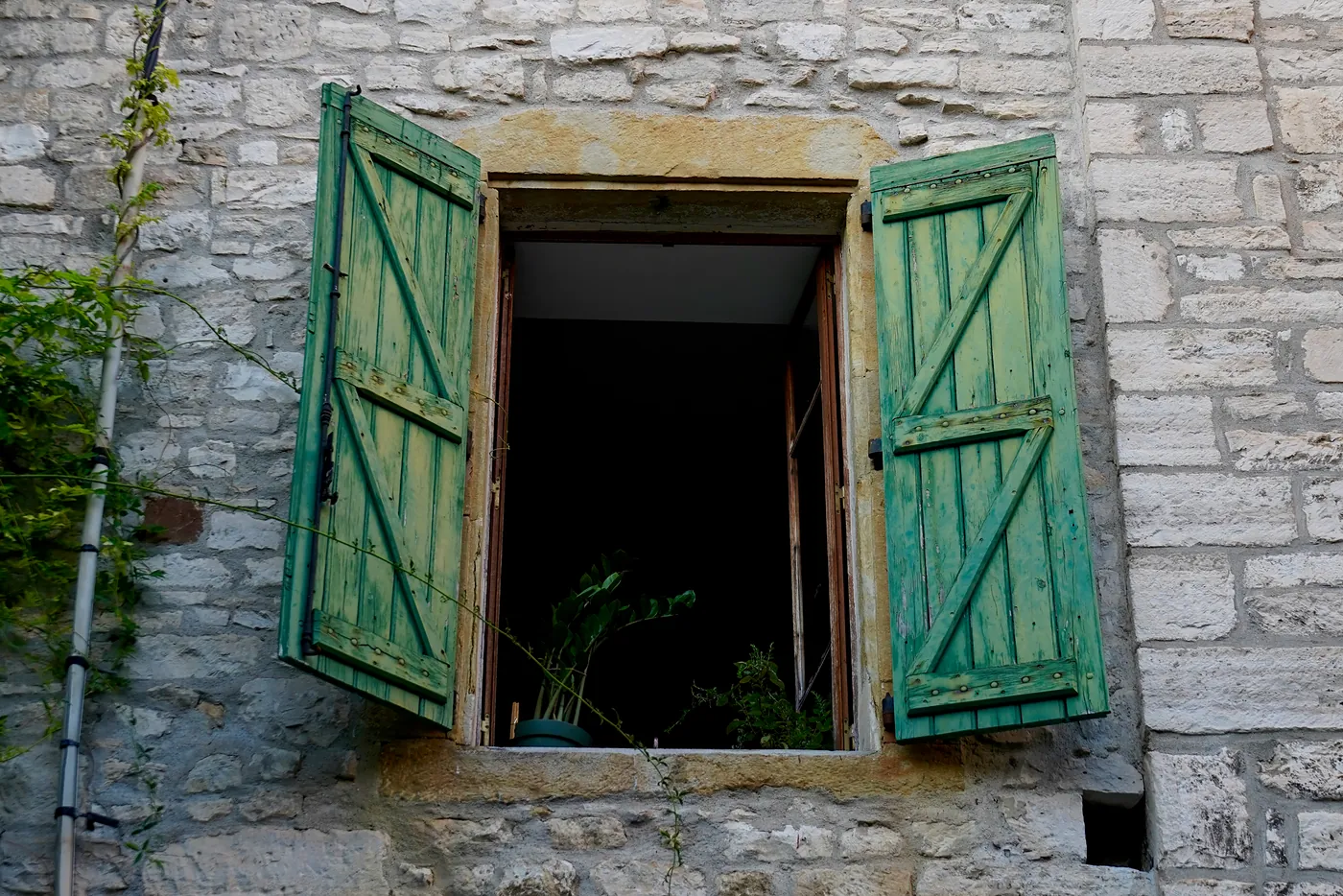 Green shutters opened to the gentle wind of the early evening.
