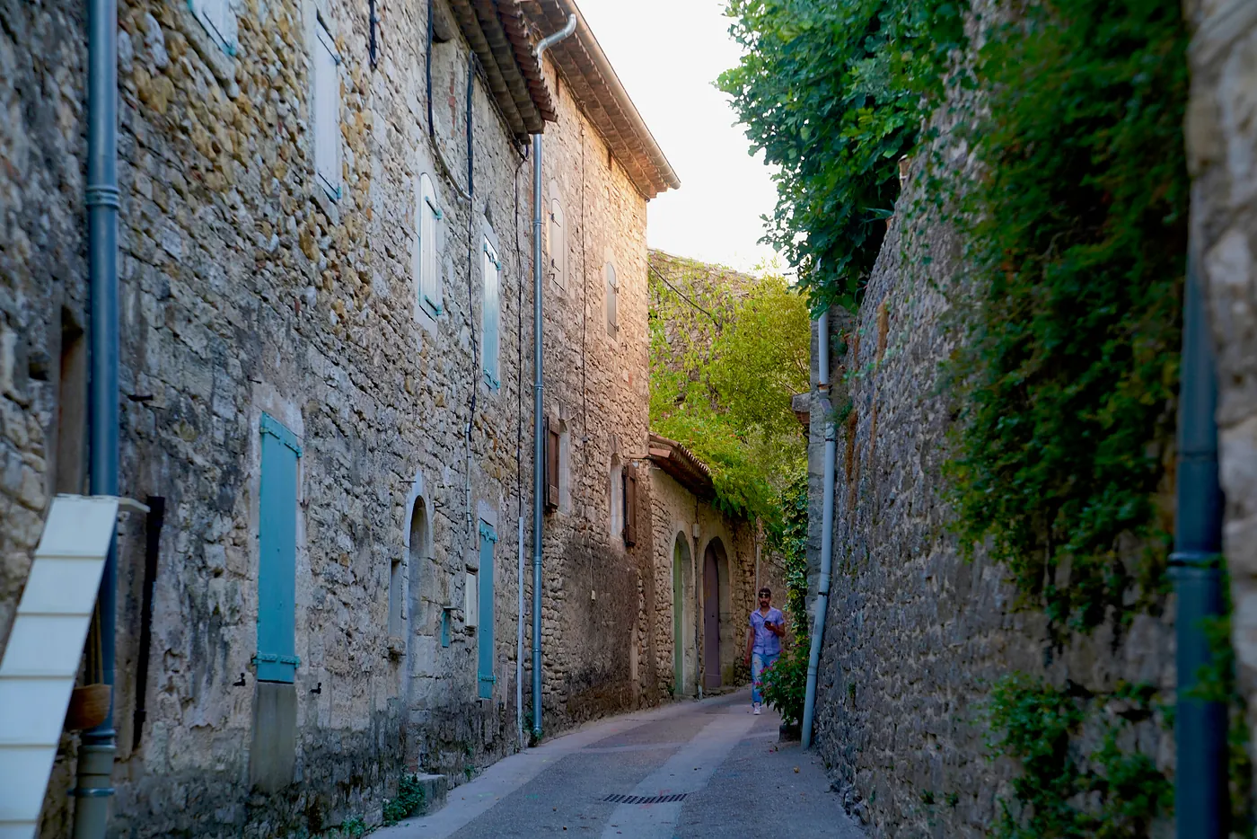 An alleyway leading west toward Vézénobres' western gate. Though the village is normally quiet, virtually all of the rooms behind the closed, wooden shutters are inhabited.