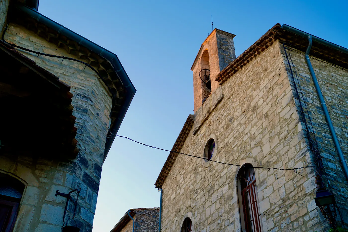 The side of the village's Temple. Southern France is the primary remaining area where Protestant Christianity is disproportionately practiced. These Protestants call their houses of worship 'Temples,' not 'Churches,' and thus take after their Huguenot forefathers.