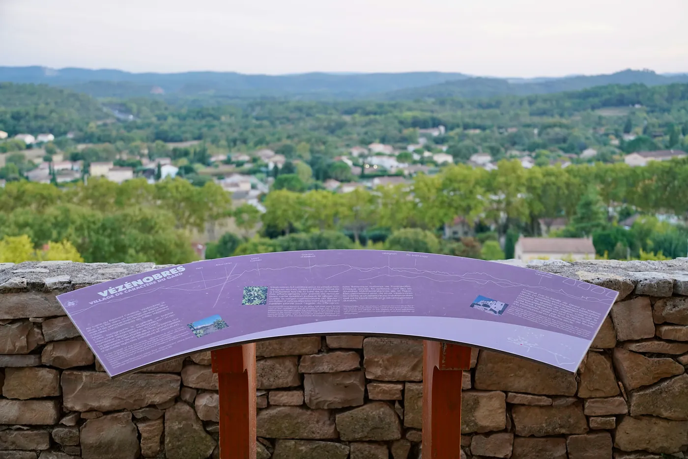An informational board telling the history of Vézénobres and the surrounding region.
