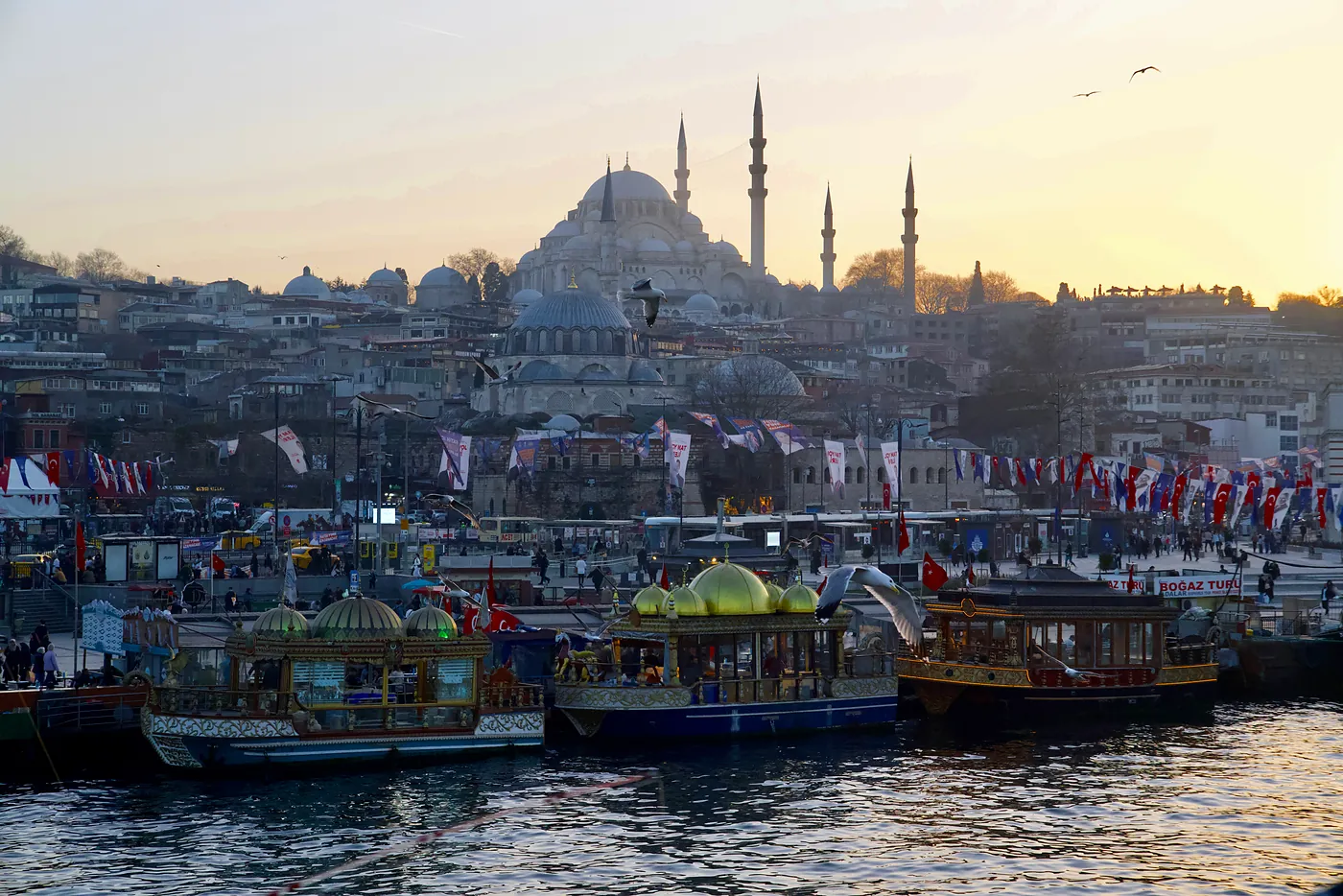A view of the Suleymaniye Mosque towering over Eminönü's busy outdoor market and floating tea shops.