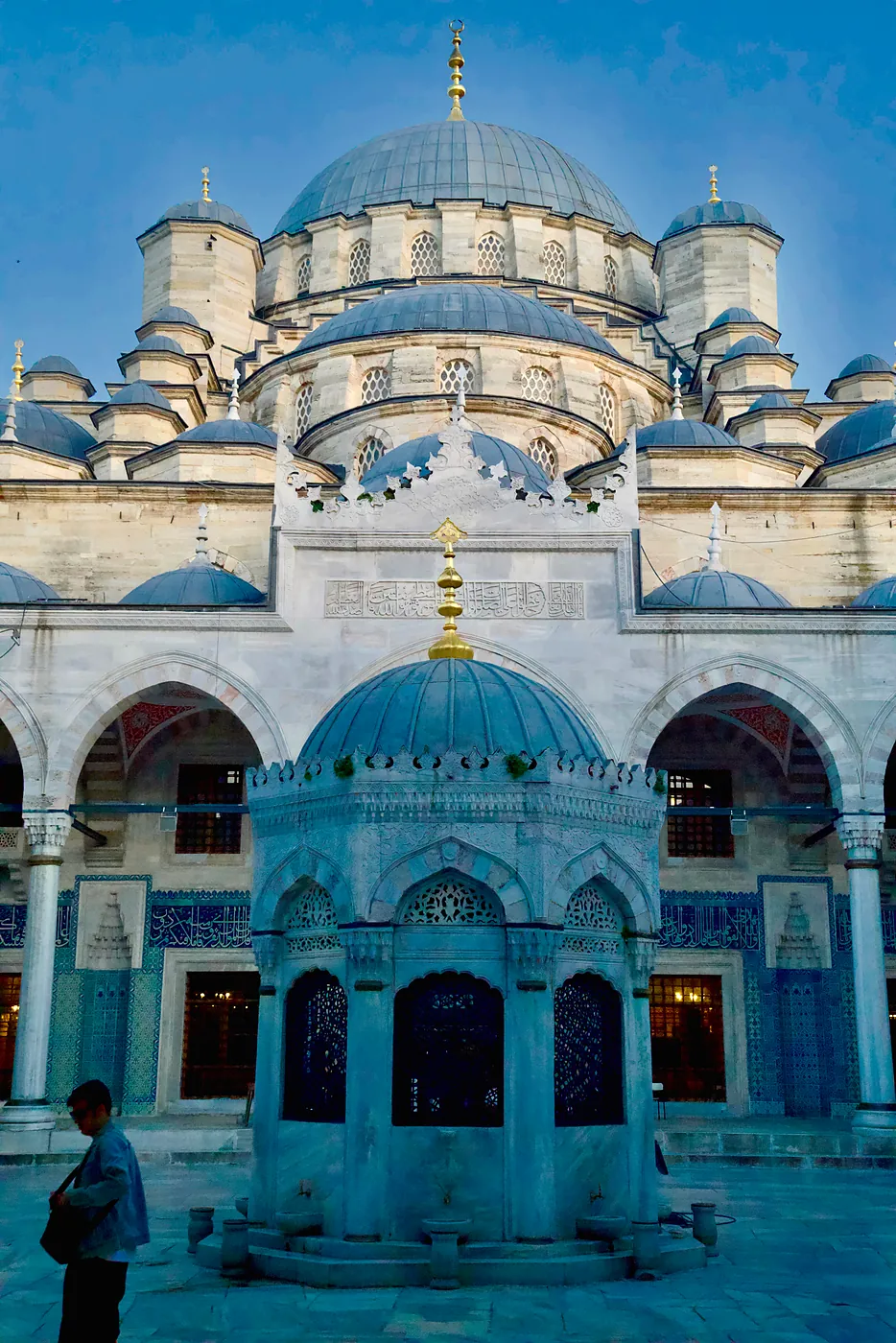 The New Mosque's courtyard in the blue shadows of an evening sun.