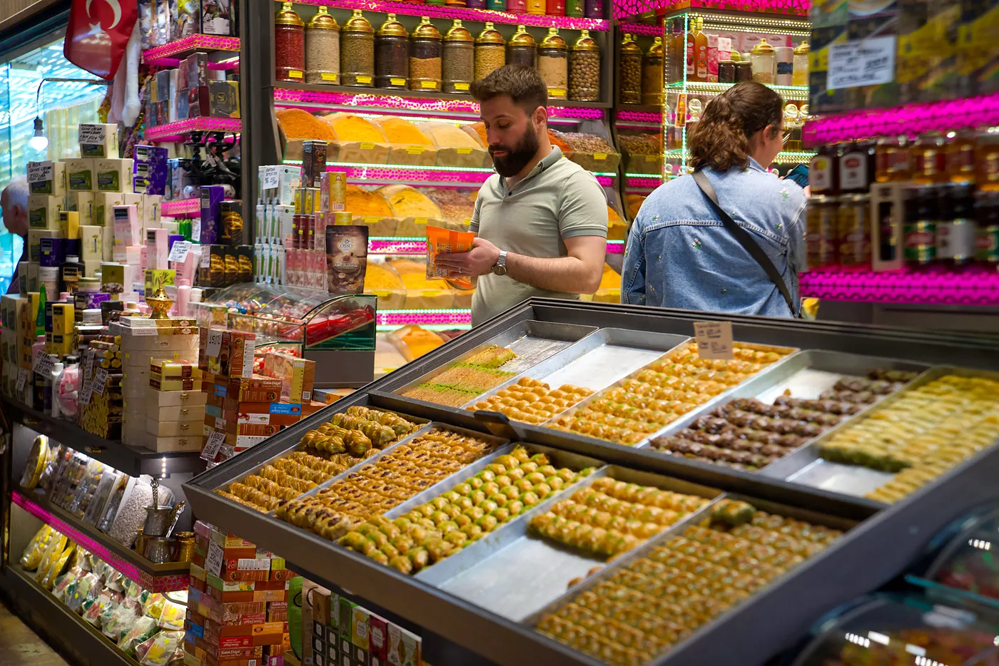 Rows of baklava in the front of another shopkeeper's stall.