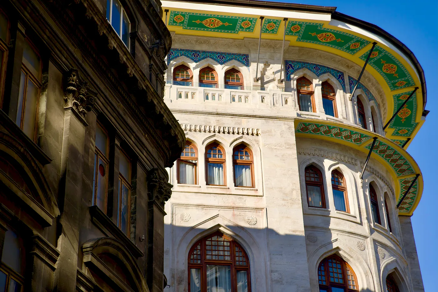 The top of an old and ornate building from the late Ottoman Empire.