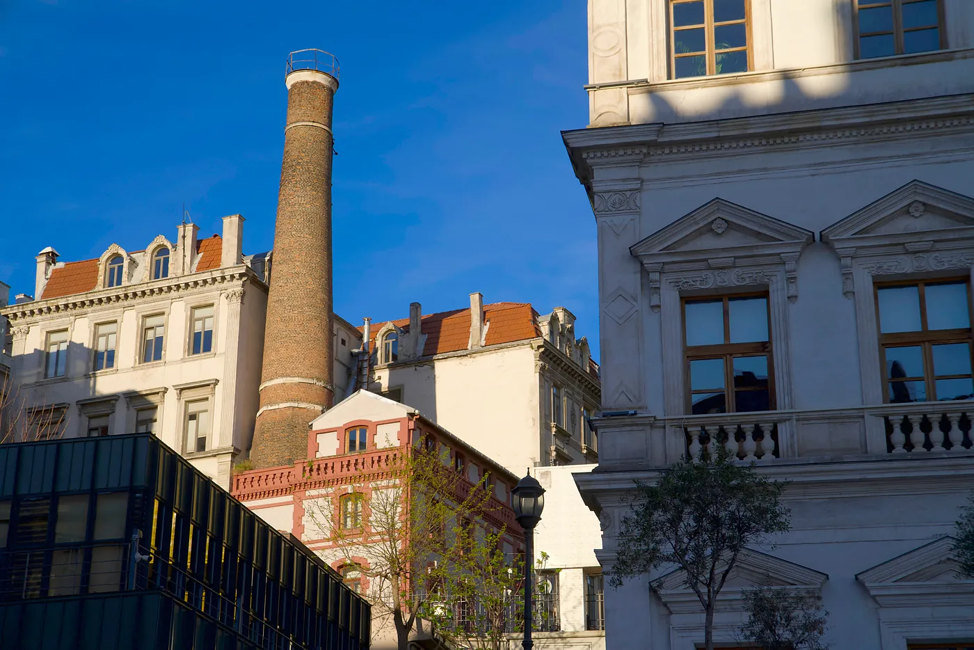 An old smokestack towering above a Galata neighborhood.