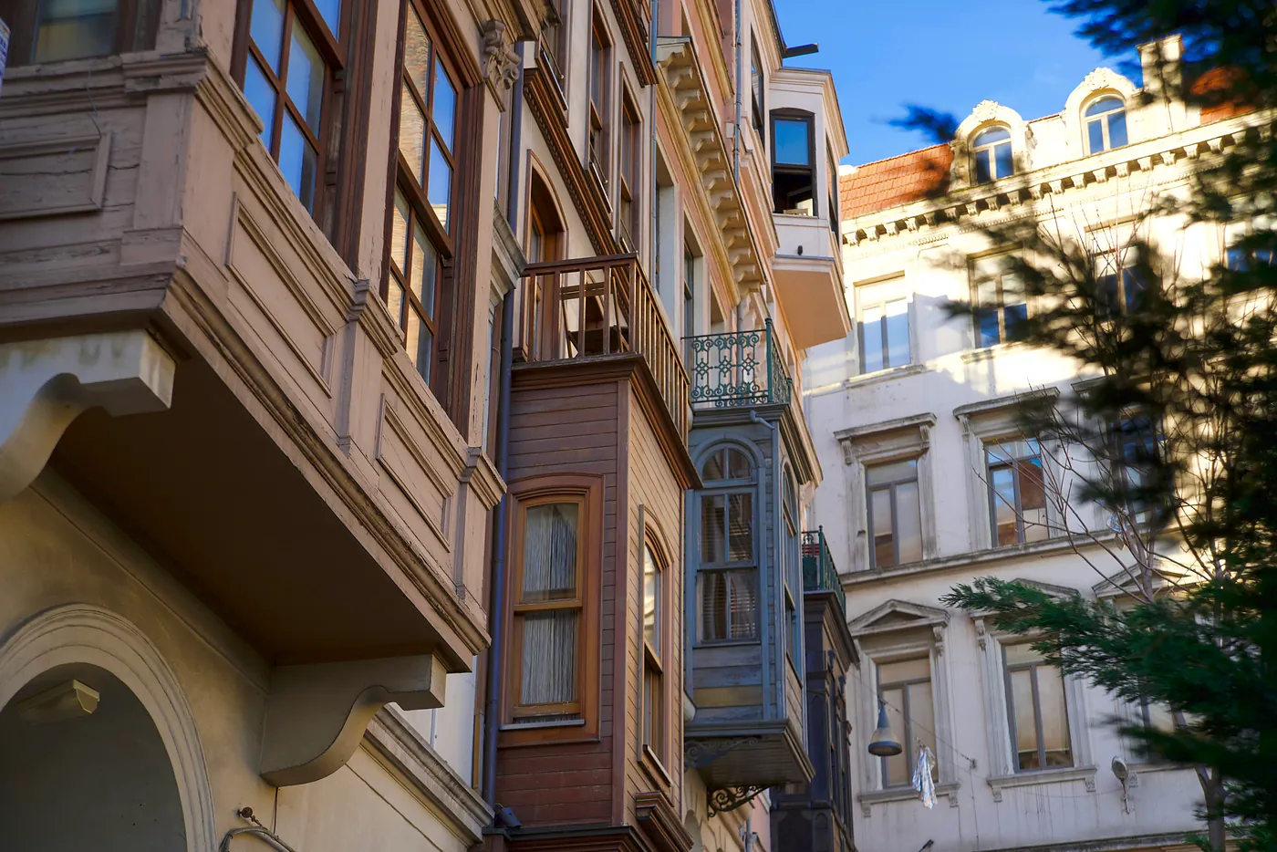 Traditional Ottoman sitting rooms and balconies jutting out of ornate apartment buildings.