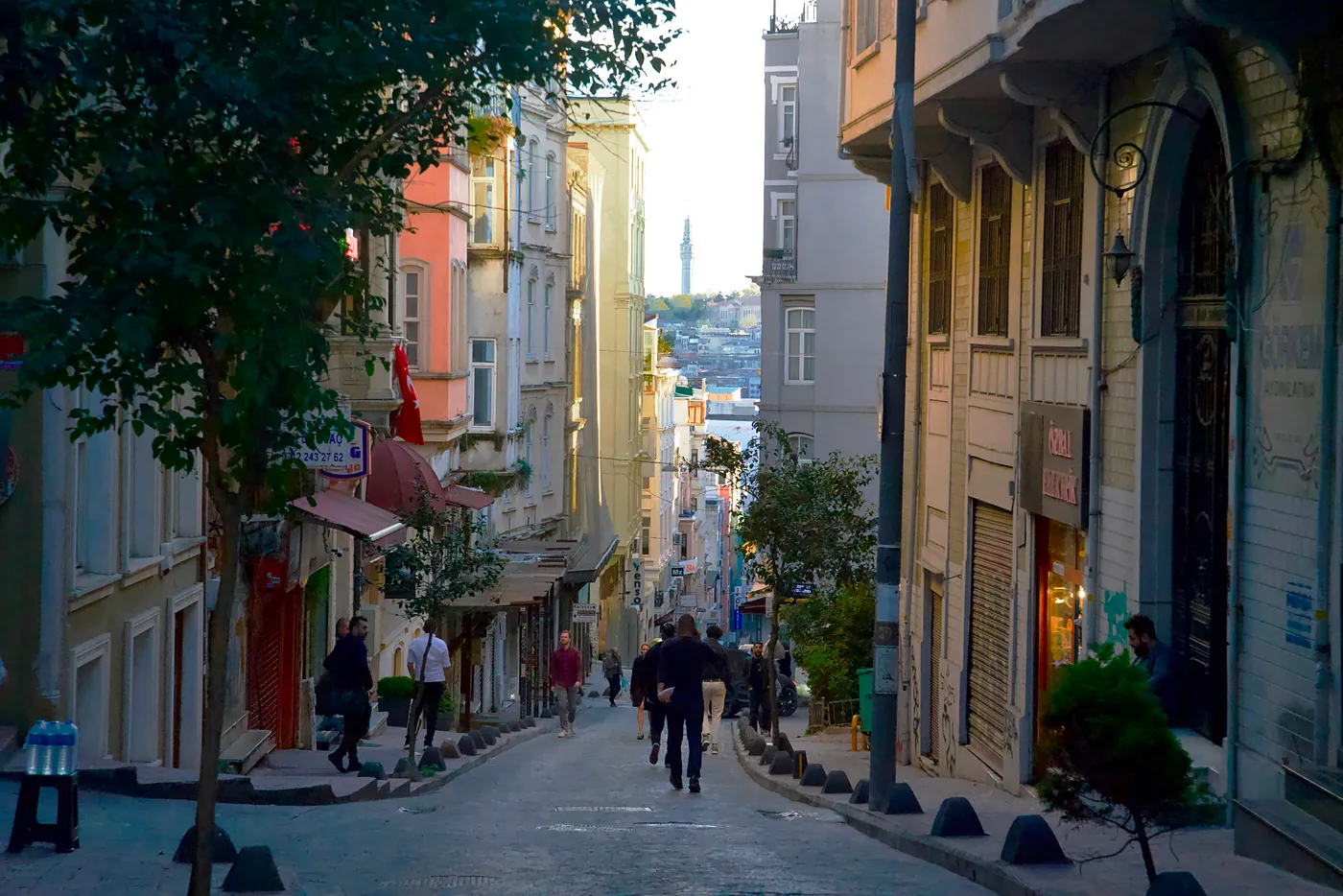 A small road meandering down a steep hill.