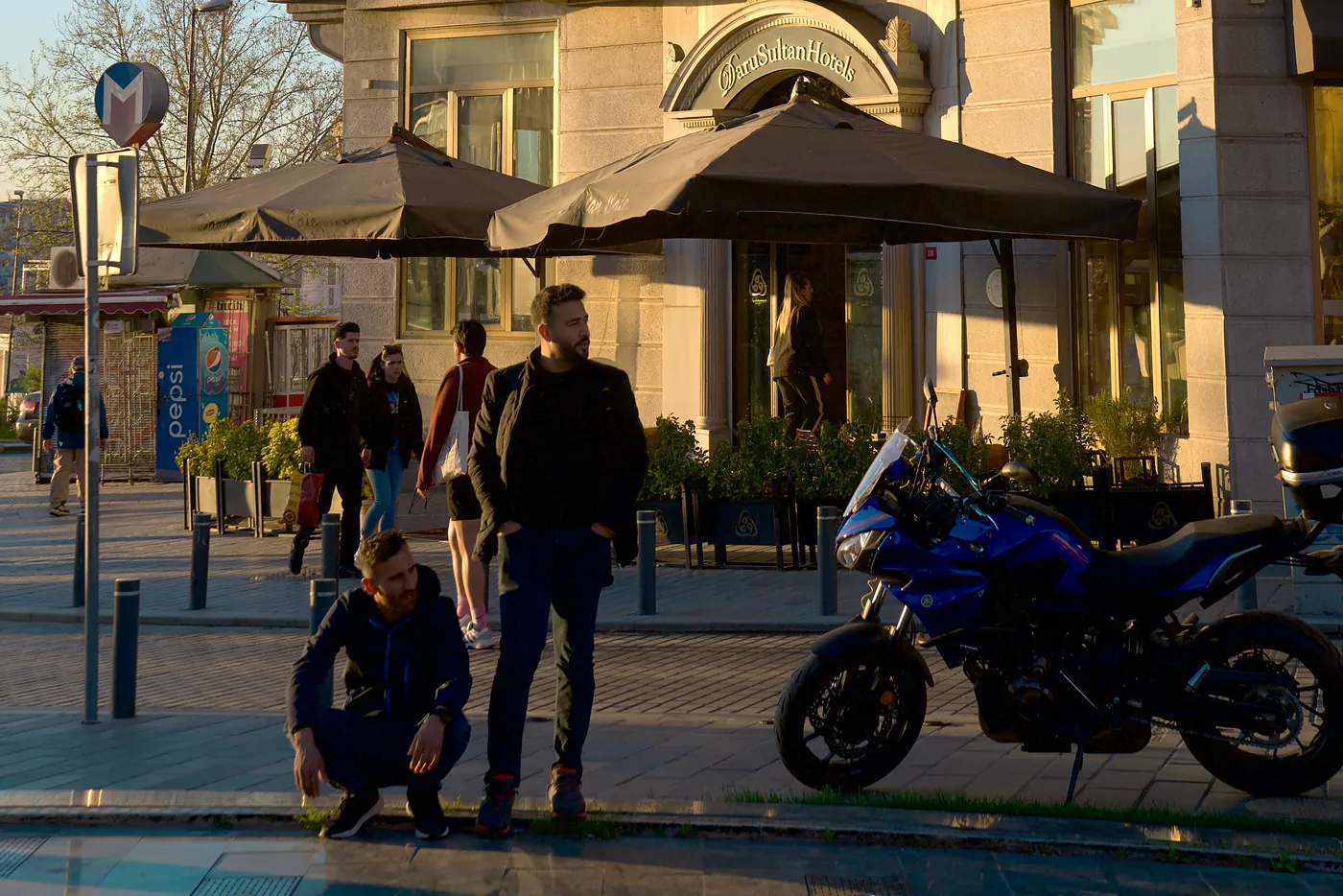 Two friends next to a bike.