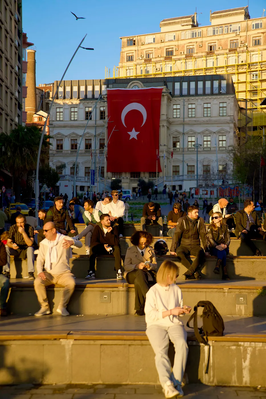 Groups of people gathered to watch the setting sun.