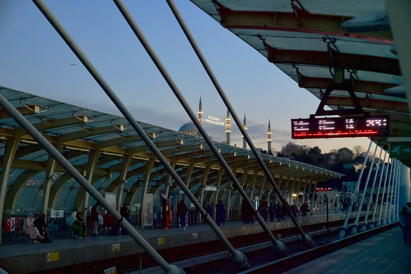 The inside of the Hiliç metro bridge with the Suleymaniye Mosque in the background.
