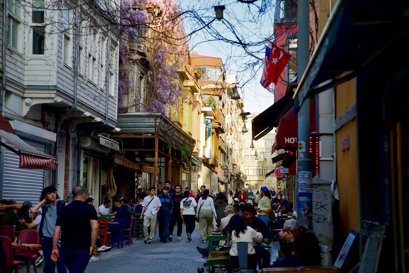 A cafe-lined street in the shade.
