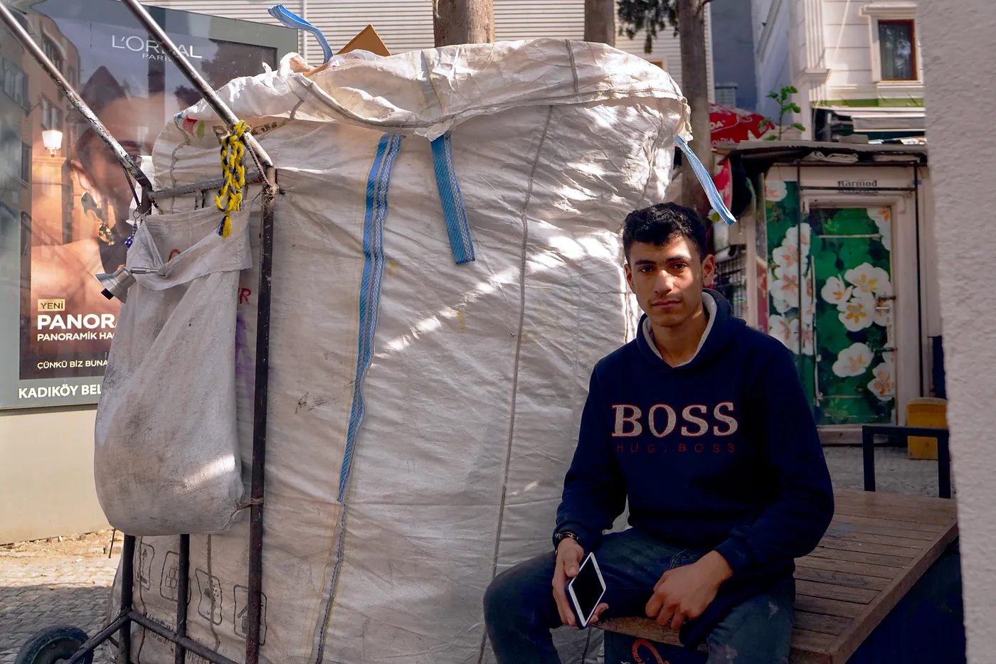 A young Syrian boy with his garbage cart. The city of Istanbul informally hires Syrian refugees to act as garbage collectors - most of which are younger than 14.
