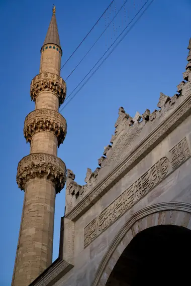 Minaret of an Ottoman mosque against a clear blue sky, Istanbul