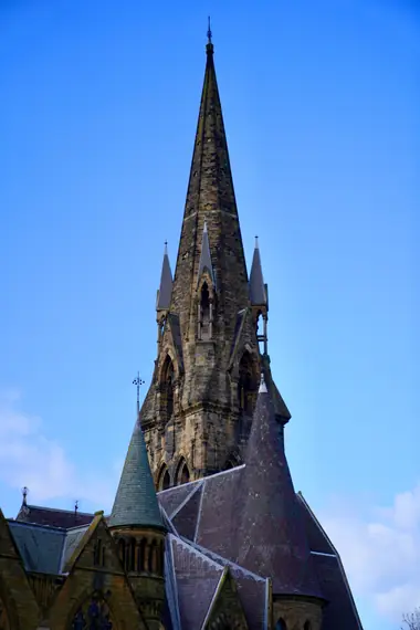 Gothic church spire against a blue sky, Edinburgh